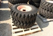 TWO TITAN 12.5/80-18 TIRES WITH 6 BOLT RIMS