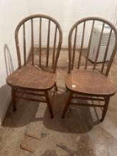 To spindle back round top oak chairs