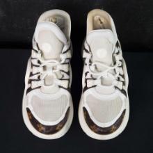 Pair of used womens Louis Vuitton tennis shoes unknown size