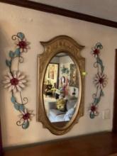 wall mirror and letal flower decor.
