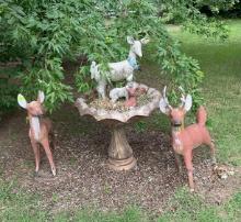 Two cement deer very heavy and birdbath very heavy with a decor inside theres quite a bit of Cracks