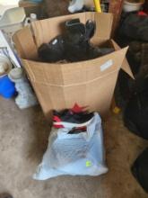boxes and bags of mens and womens shoes