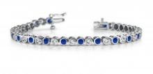 14KT WHITE GOLD 2 CTW G-H SI2/SI3 CLASSIC ROUND BEZEL SET DIAMOND & TANZANITE TENNIS BRACELET