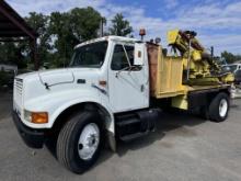 1996 International 4700 with Sterling Guard Rail Post Driver.