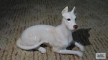 White ceramic dog figurine with number 3039 on the bottom