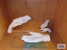 Three different hand statues