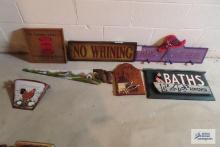 Variety of wall hanging items, including a painted saw. Shaker salt sign. No whining and others