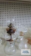 Variety of oil lamps and crystal shade