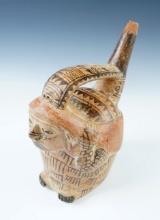 7 1/4" Pre-Columbian Moche Stirrup Bottle depicting a person carrying a burden bag.