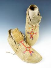 Beautiful quill work on this pair of Leather Moccasins in very good condition. They are 10" long.