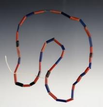 17" Strand of red, blue and striped Tubular Straw Beads. Recovered at the Dann Site