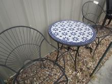 Two Wrought Iron Roll Back Patio Chairs
