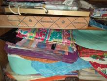 (KIT) CABINET LOT OF ASSORTED ITEMS TO INCLUDE, HOLIDAY THEME PLACEMATS, TABLECLOTHS, CHRISTMAS
