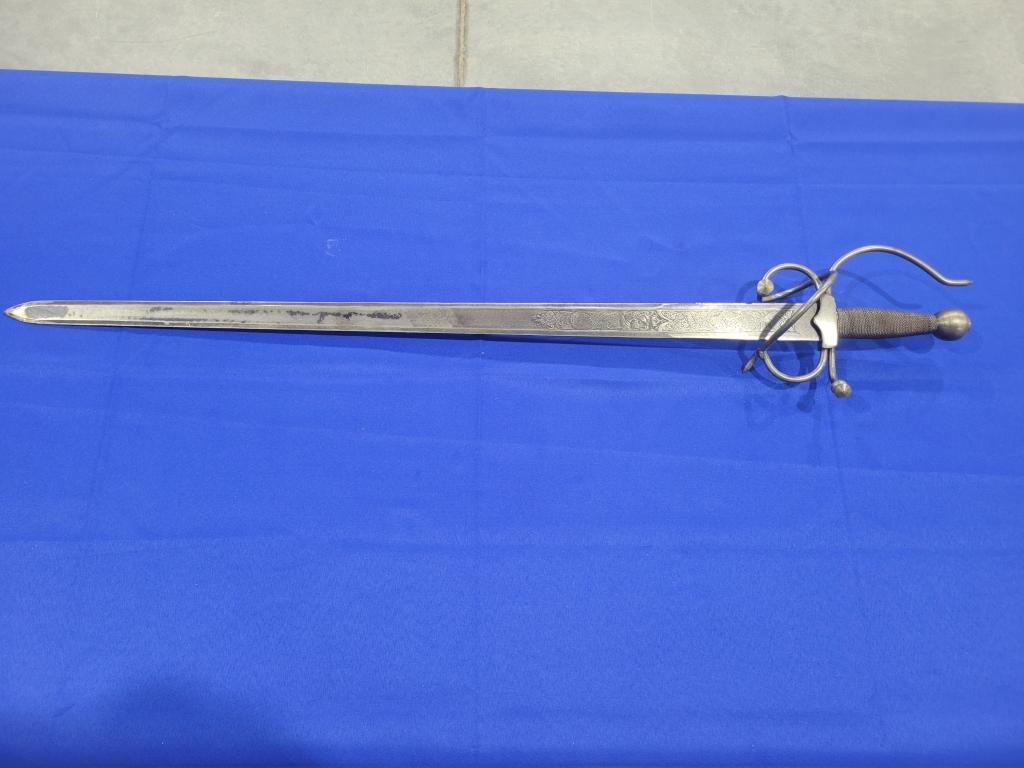 Replica Saber Replica saber, does have etching up and down blade, ornate hand shield, measures 39"