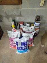 Bags of red out and water softener salt, paints