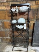 wire shelf with milk glass dishes and wall hanging dispenser