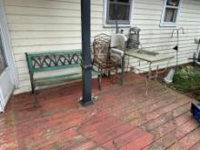 outdoor patio table and chairs with park bench.