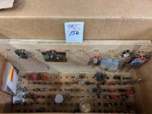 large amount of router bits and holder in box